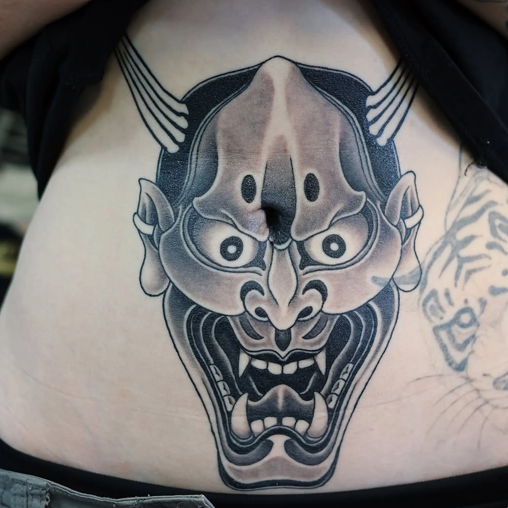 clearly visible australian-style tattoo